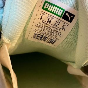 Women’s Puma tennis shoes- light blue in color with white trim- size 6.